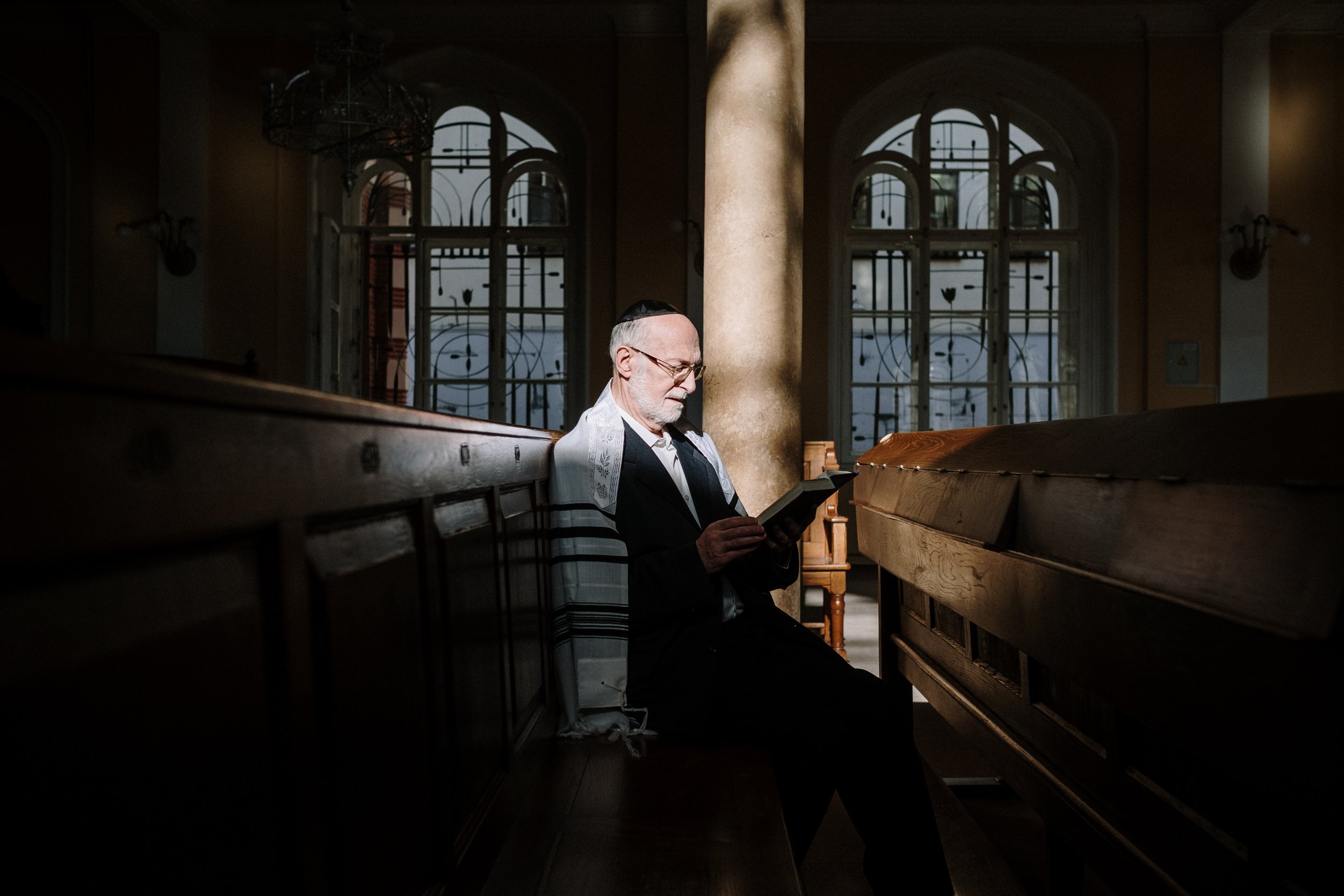 A Man Sitting inside the Church